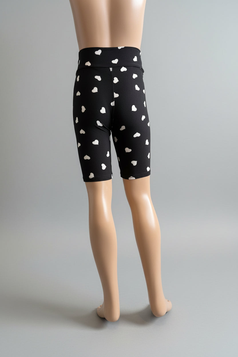 Black soft touch shorts with white hearts