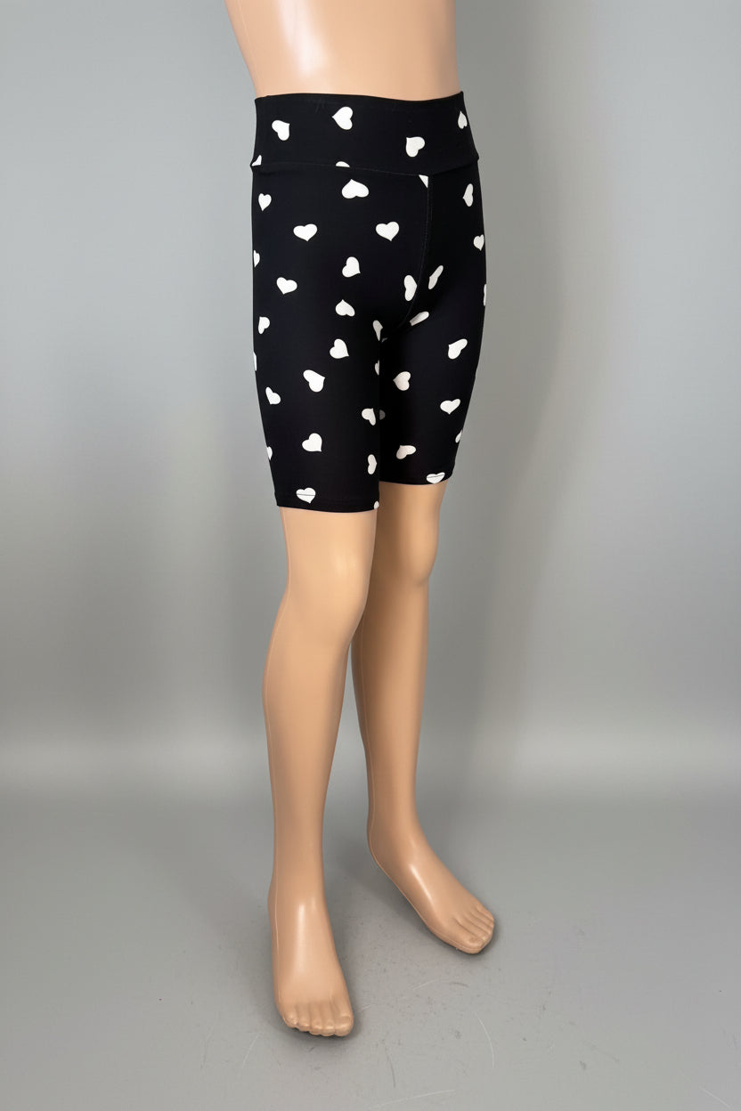 Black soft touch shorts with white hearts