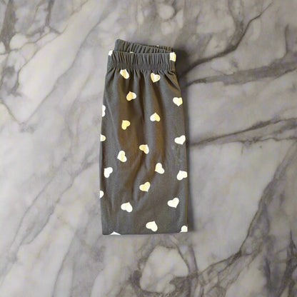 Black leggings with white hearts design