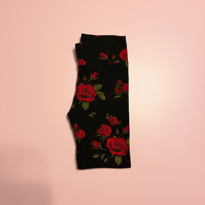 Red rose on black leggings