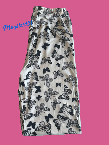 White leggings with black butterfly design, full length